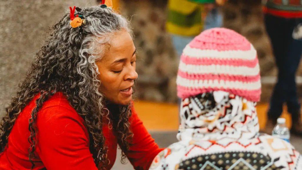 Volunteer reading with a child